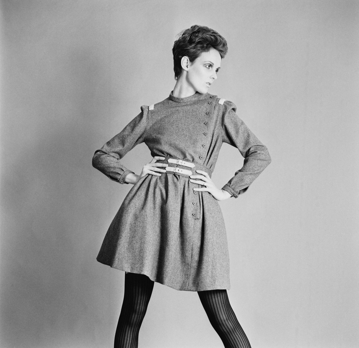 British model Grace Coddington showing a grey flannel day dress and buckle belt by Christiane Bailly, 18th April 1967. (Photo by McKeown/Express/Hulton Archive/Getty Images)