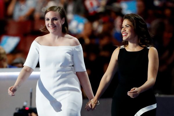 PHILADELPHIA, PA - JULY 26: Actresses America Fererra (R) and Lena Dunham (L) arrive on stage to deliver remarks on the second day of the Democratic National Convention at the Wells Fargo Center, July 26, 2016 in Philadelphia, Pennsylvania. Democratic presidential candidate Hillary Clinton received the number of votes needed to secure the party's nomination. An estimated 50,000 people are expected in Philadelphia, including hundreds of protesters and members of the media. The four-day Democratic National Convention kicked off July 25. (Photo by Aaron P. Bernstein/Getty Images)