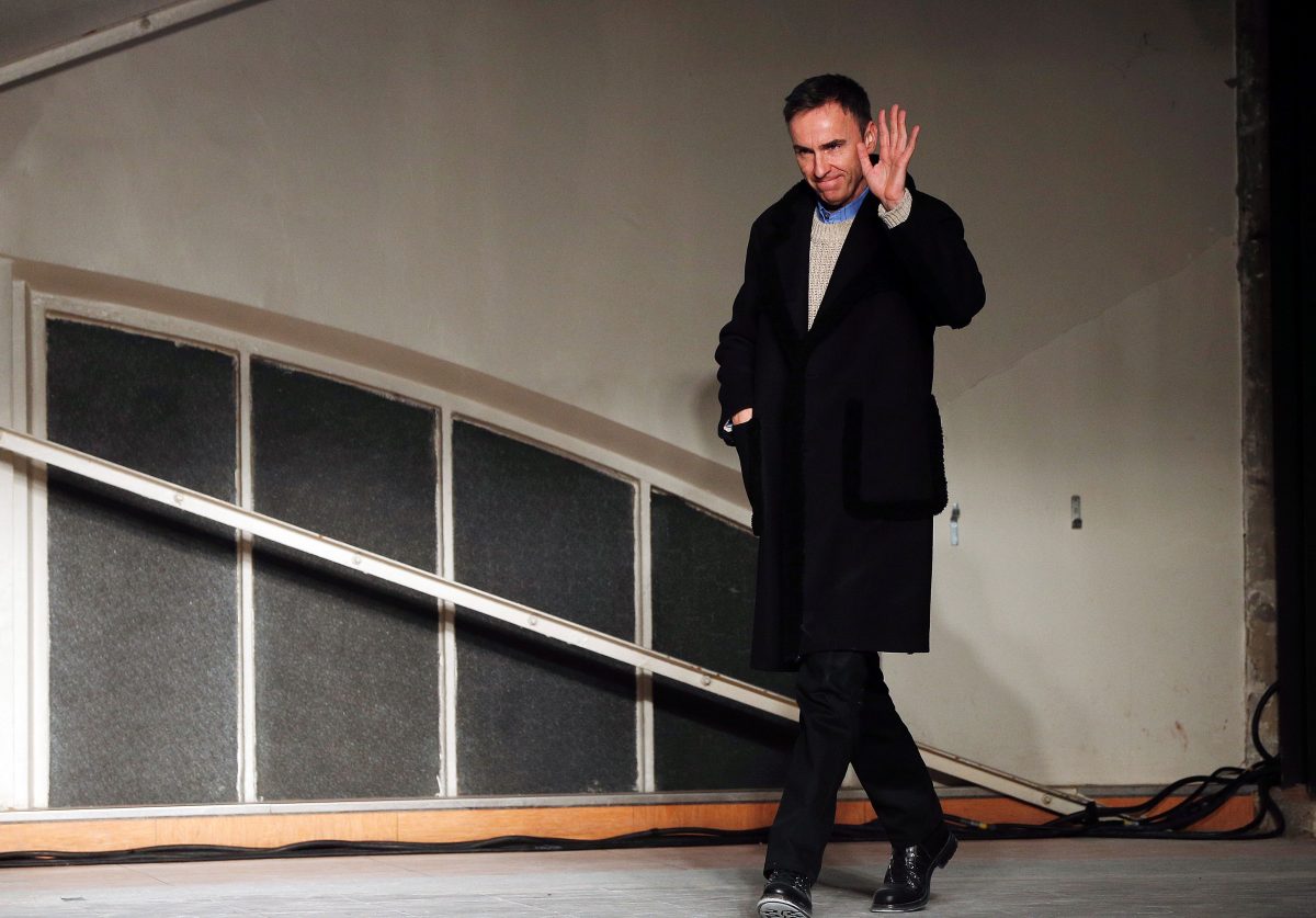 Belgian designer Raf Simons acknowledges the crowd at the end of his fashion show during the men's Fashion Week for the 2016-2017 Fall/Winter collection in Paris on January 20, 2016. / AFP / FRANCOIS GUILLOT (Photo credit should read FRANCOIS GUILLOT/AFP/Getty Images)
