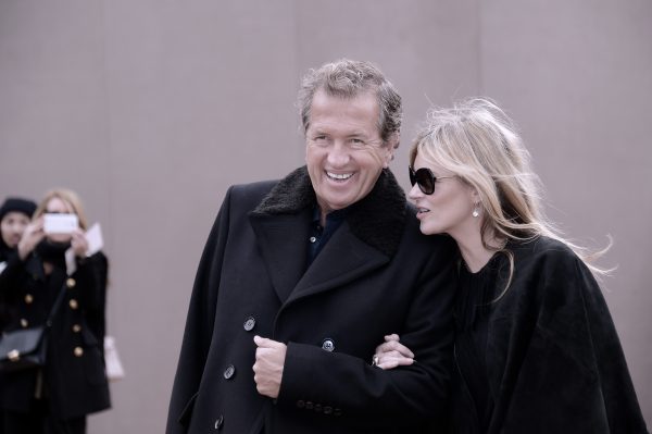 LONDON, ENGLAND - FEBRUARY 23: (Editors Note: Image has been digitally altered) Mario Testino and Kate Moss attend the Burberry Prorsum show during London Fashion Week Fall/Winter 2015/16 at Perk's Field on February 23, 2015 in London, England. (Photo by Gareth Cattermole/Getty Images)