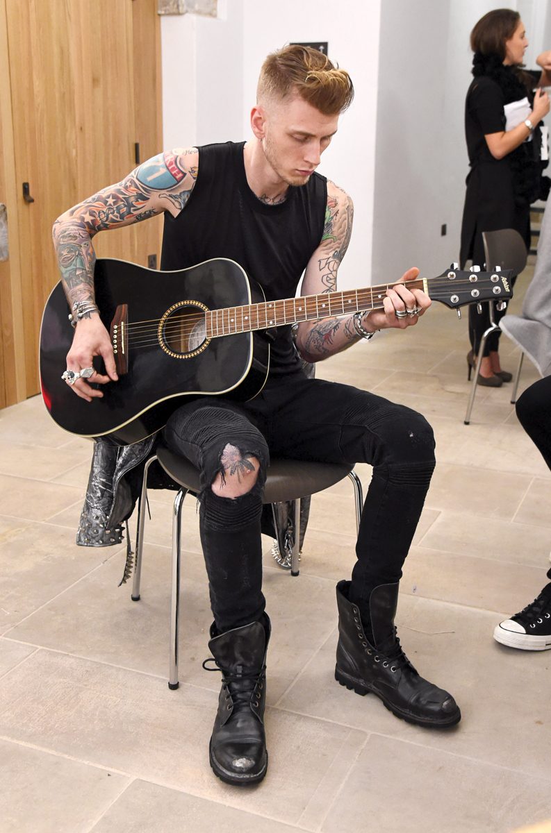 LONDON, ENGLAND - JANUARY 08: Machine Gun Kelly backstage following the Joshua Kane Bespoke with Lab Series runway show during London Collections Men AW16 at Christ Church Spitalfields on January 8, 2016 in London, England. (Photo by David M. Benett/Dave Benett/Getty Images for Joshua Kane with Lab Series)
